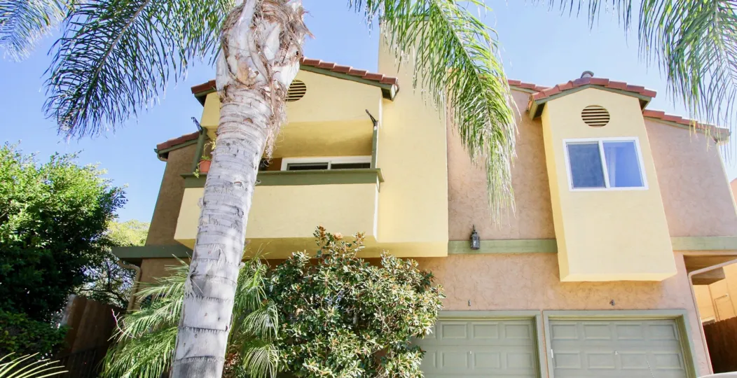 A sunny day in the area of Park Place, palm trees, outside, balcony, garages, window, bush