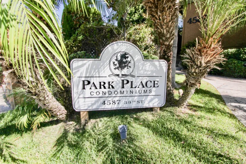 Apartment sign at entrance of Park Place with landscaping in Normal Heights, Ca.
