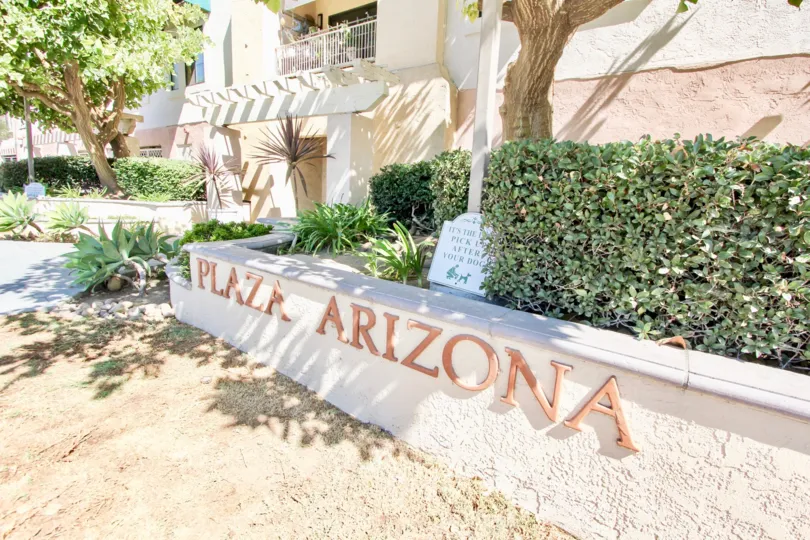 The large street sign outside of Plaza Arizona in California.