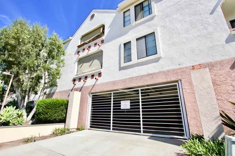 A well groomed lawn and gated garage in Plaza Arizona, Normal Heights, California on a sunny day