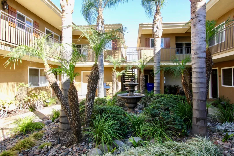 Outdoor fountain and greenery in the courtyard of Stone Manor community in Normal Heights, CA