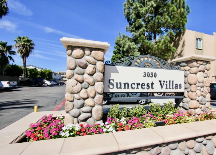 Entrance view with designed rocks pillar and garden in Suncrest Villas.