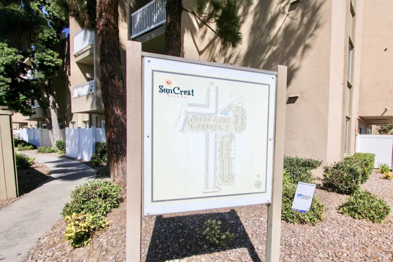 The exterior of Suncrest Villa and the sign of housing in Normal heights