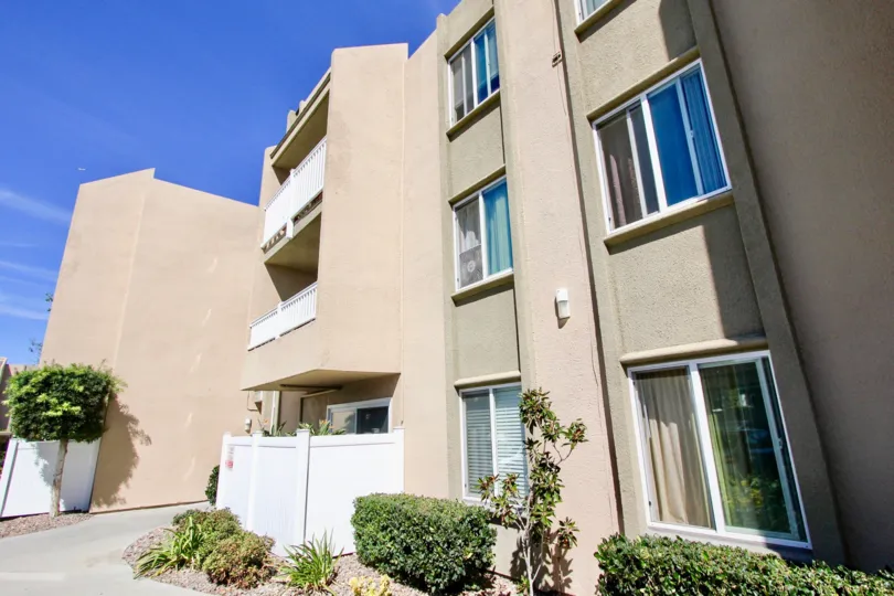 Balcony overlooking entrance with tree in Suncrest Villas.