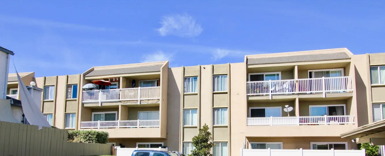 THE VILLAS IN THE SUNCREST VILLAS WITH THE CAR PARKING, DISH ANTENNA, UMBRELLAS, BALCONIS
