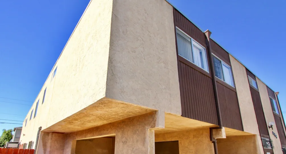 A two story cement and wood town home building in Normal Heights CA at Teralta Heights