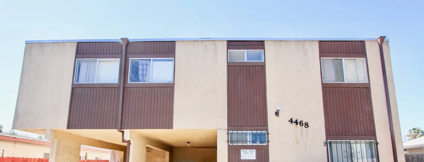 A sunny day in the area of Teralta Heights, car port, windows, condos, outside