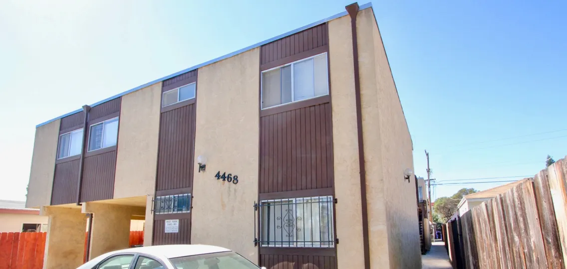 A sunny day in the area of Teralta Heights, outside, car, window, wooden fence, walkway