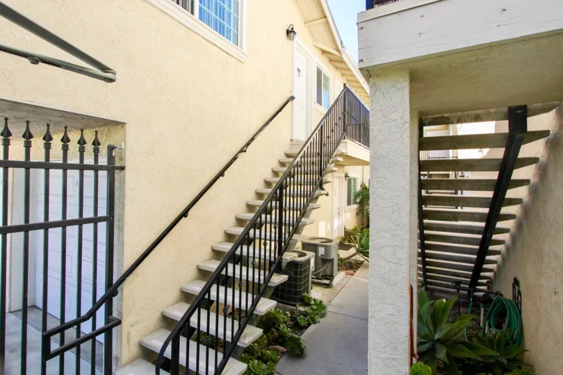Open riser stairs with wrought iron railings for units at The Bentley