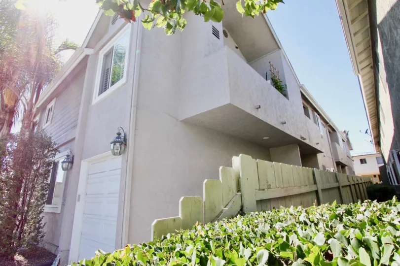 Beautiful grey home located in The Layfayette, Normal Heights, California. Has a single bay Garage and an overhang.