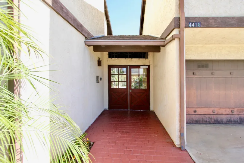 a nice broad pathway to a door leadning inside a house 4415 located in Tiffany Square, normal heights CA