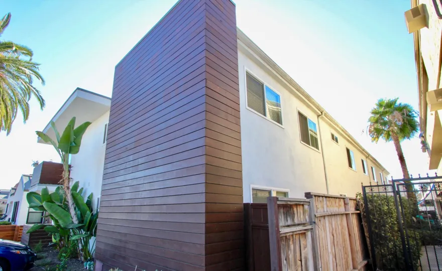 A sunny day in the area of Utah Bluffs, privacy fence, wood, gate, palm trees, car condo