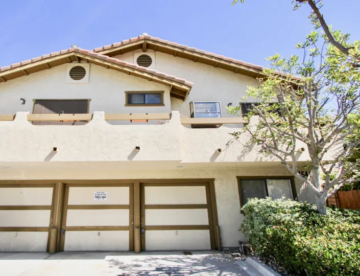 The front of a house in Utah Terrace, with a triple garage downstairs and upstairs balcony.