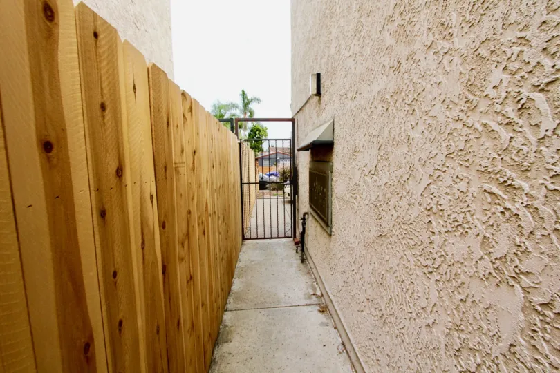 A sunny day in the area of 33rd Street Vistas, walkway, gate, fence