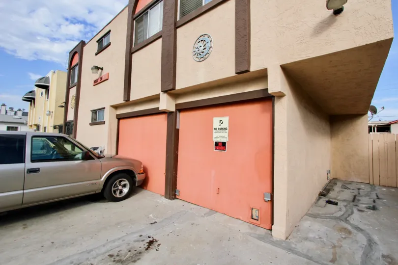 A sunny day in the area of 36th Street Condos, parking area, car, truck