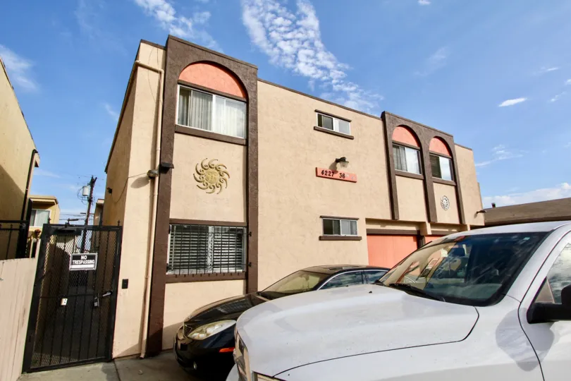A sunny day in the area of 36th Street Condos, car, truck, gated entrance, condo