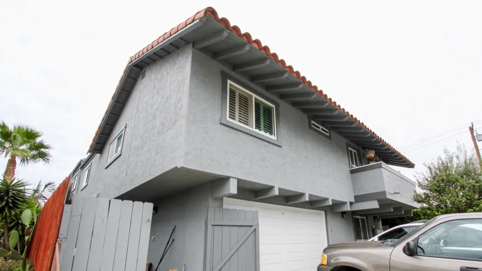 3788 Grim Ave community North Park California grey two story fence garage balcony tile roof palm tree landscaping