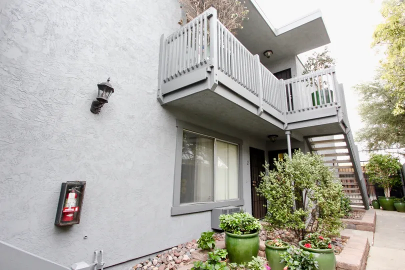 house with a first floor stair and a elegant planting with sand stones and a fire extingushier in the 3788 Grim Ave, North park, California.