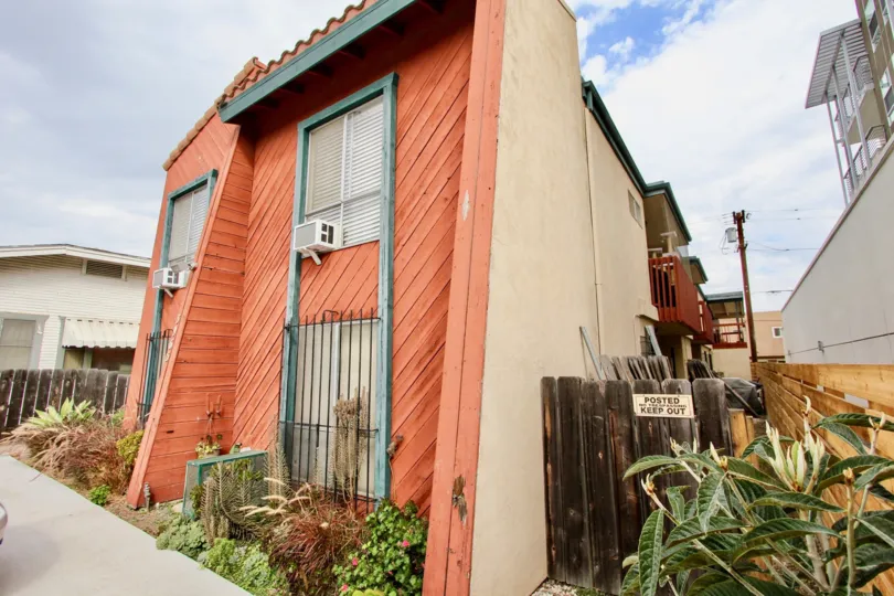 A wood faced unit with window air conditioning units located on 3965 Iowa St in North Park, California