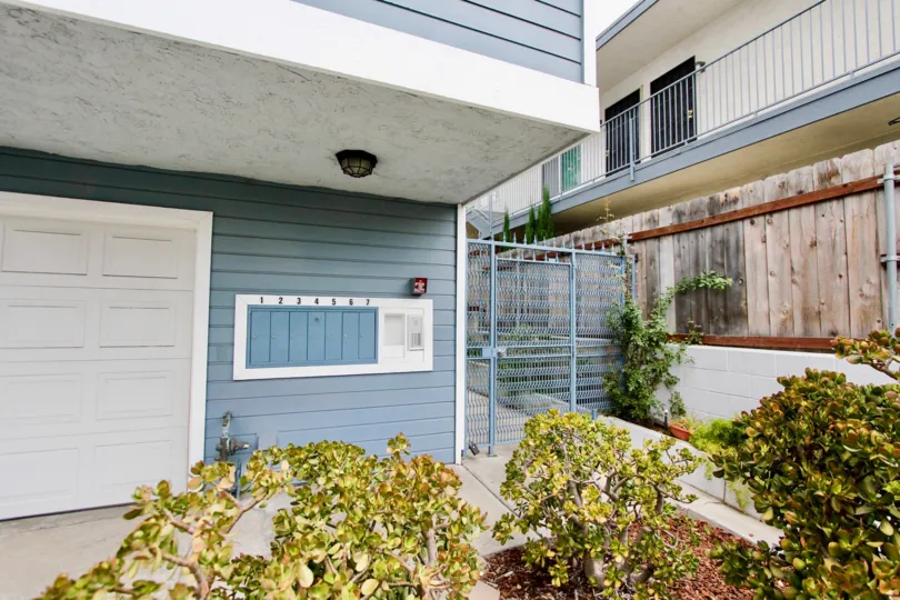 Secured gateway entrance and residential buildings at 4034 Florida St