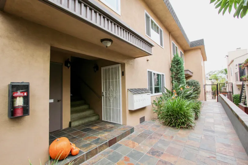 side yard of home in North Park, featuring tiles and greenery in surrounding