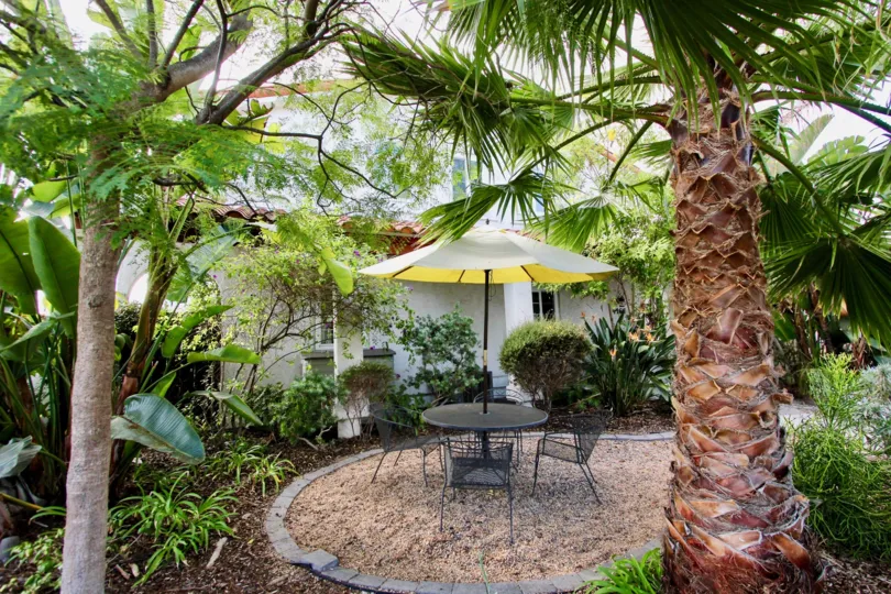 Sit out area with sand and umbrella in 4166 Wilson Ave.