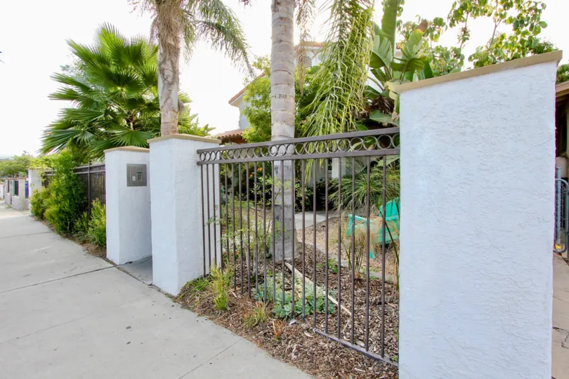 A sunny day in the area of 4166 Wilson Ave, Condo, fence, palm trees