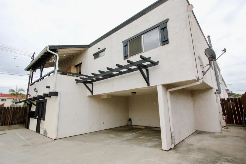 big car porch with contemporary styling house with wood seperating boundary wall of 4185 Louisiana St of North park, CA