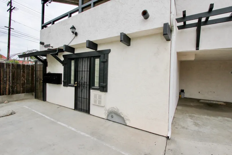 A sunny day in the area of 4185 Louisiana Street, condo, gated door, parking area
