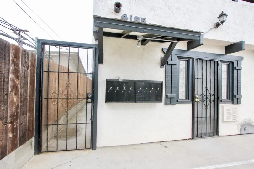 A sunny day in the area of 4185 Louisiana St, gated entrance, door, mailbox, light