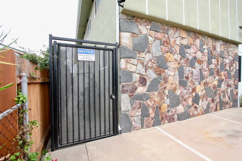 Oregon St  , North Park  , California, stone wall, white sky