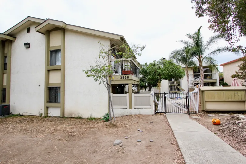 Alabama 12 apartment community North Park California gate fence patio balcony windows pool palm tree