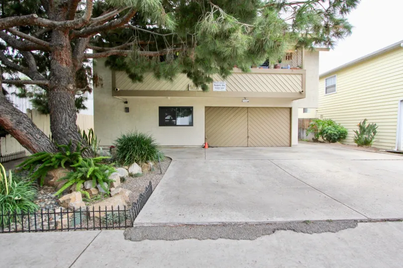 Alabama Villas in North Park, California is surrounded by large trees to provide shade on hot Southern California days