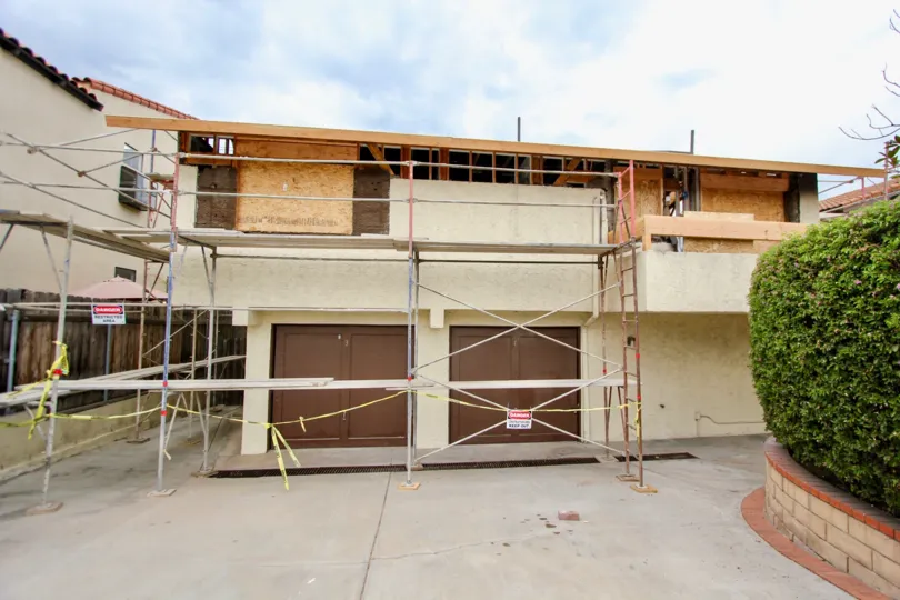 Construction site in the community of Arnold Avenue in North Park, California. Brown building with caution tape.