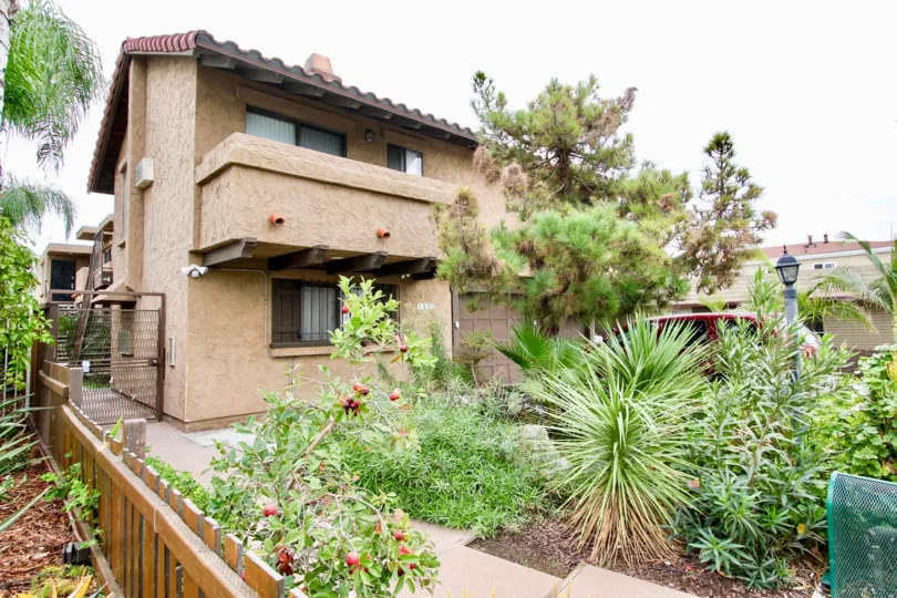 Barcelona Villa community North Park California landscaping balcony fence windows adobe southwestern style apartments trees