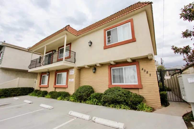 A sunny day in the area of Bella Villaggio, parking lots, condo, porch, window