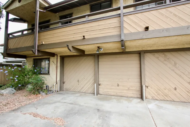 Garage doors and front yard of Birchmore community in North Park, CA