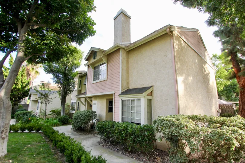 The way to the house in the California Village has meadow, plants on the both sides
