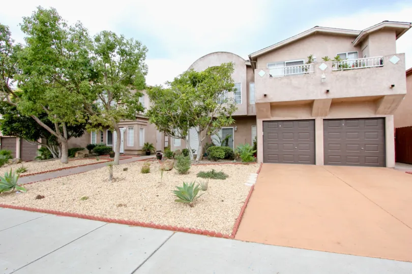 Cameo in North Park, California has a desert stucco theme to the housing while plants line the terrace outside