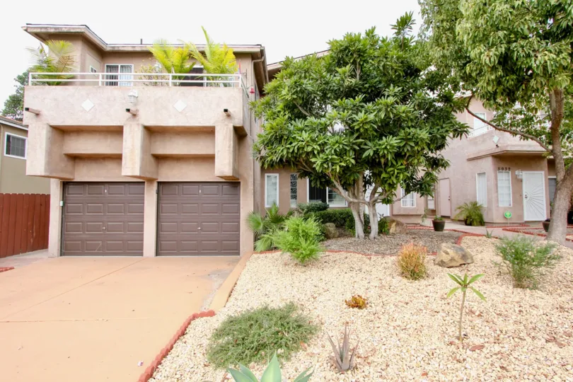 Driveway in front of residential building with built in garages at Cameo in North Park California