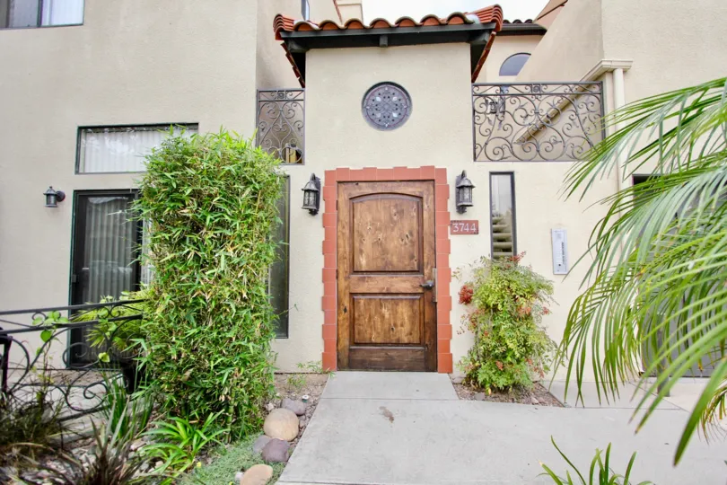 A deck rail with ornate filigree adorns this upscale residence in the Casa Balboa II community.