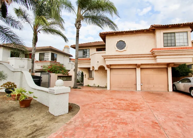 A sunny day in the area of Casa Frontera I, entrance, driveway, car, garage, palm tree