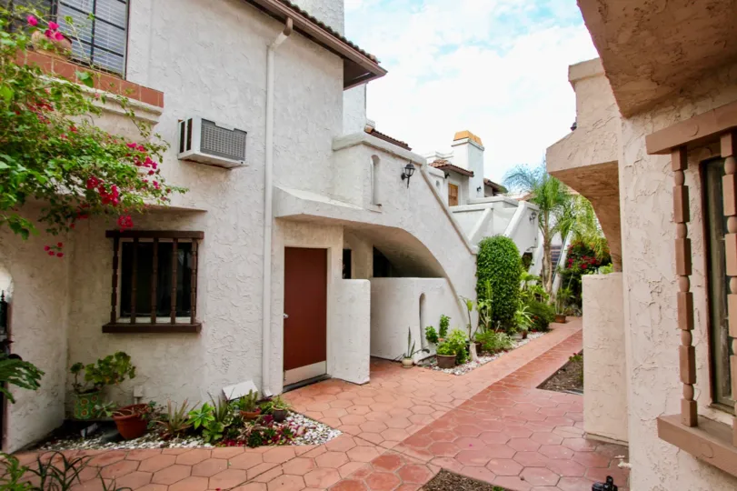 Walkway between buildings of the Casa Frontera I Apartment Complex. North Park, CA,