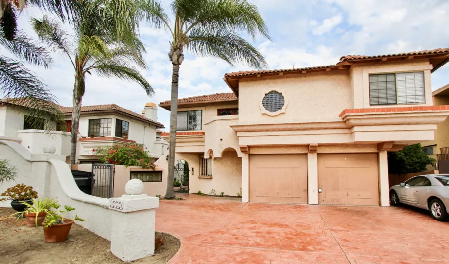 Enjoy the palm trees outside of this luxury villa located in the Casa Frontera II community
