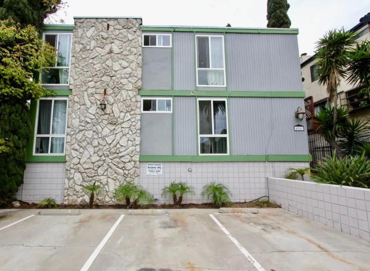 Three story housing next to parking spaces at Casa Riviera in North Park California