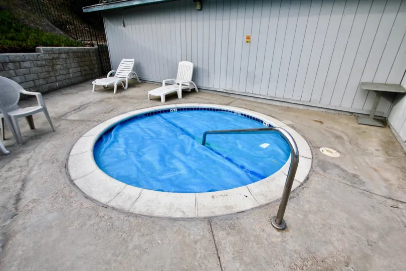 A villa in Cherokee Canyon has swimming pool and chairs
