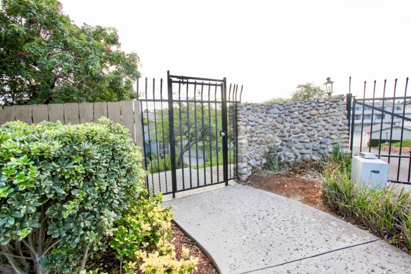 Wood, stone, and iron fence, Cherokee Canyon, North Park, California