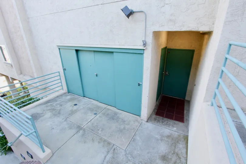 Maintenance area with blue doors and blue railings at Coral Ridge in North Park California