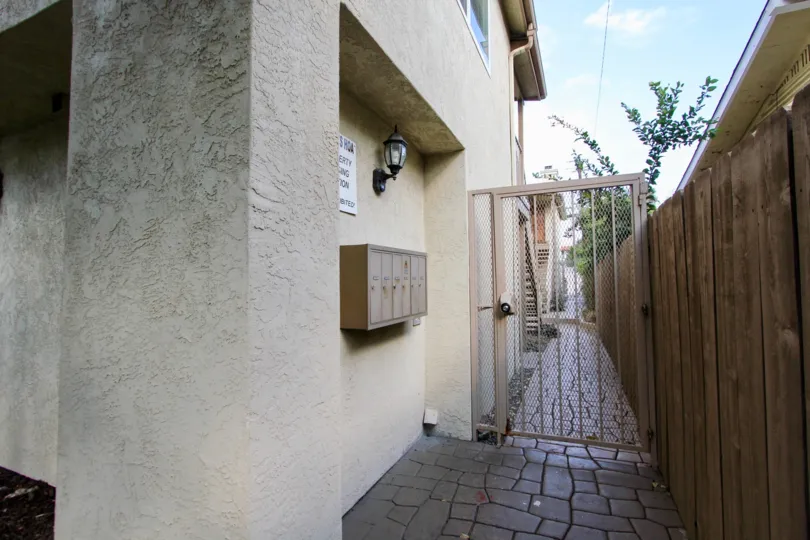Six brown metal mailboxes sit on a building at the Felton Heights condos.