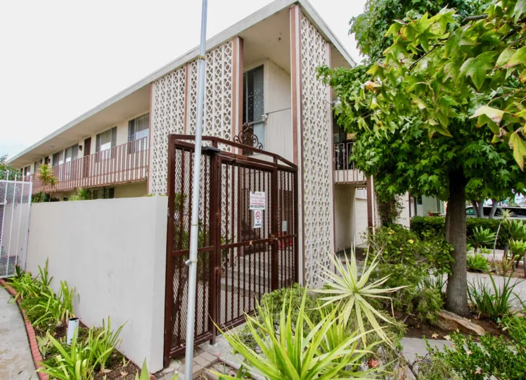 A sunny day in the area of Golden Oaks, condo, gated entrance, tree,